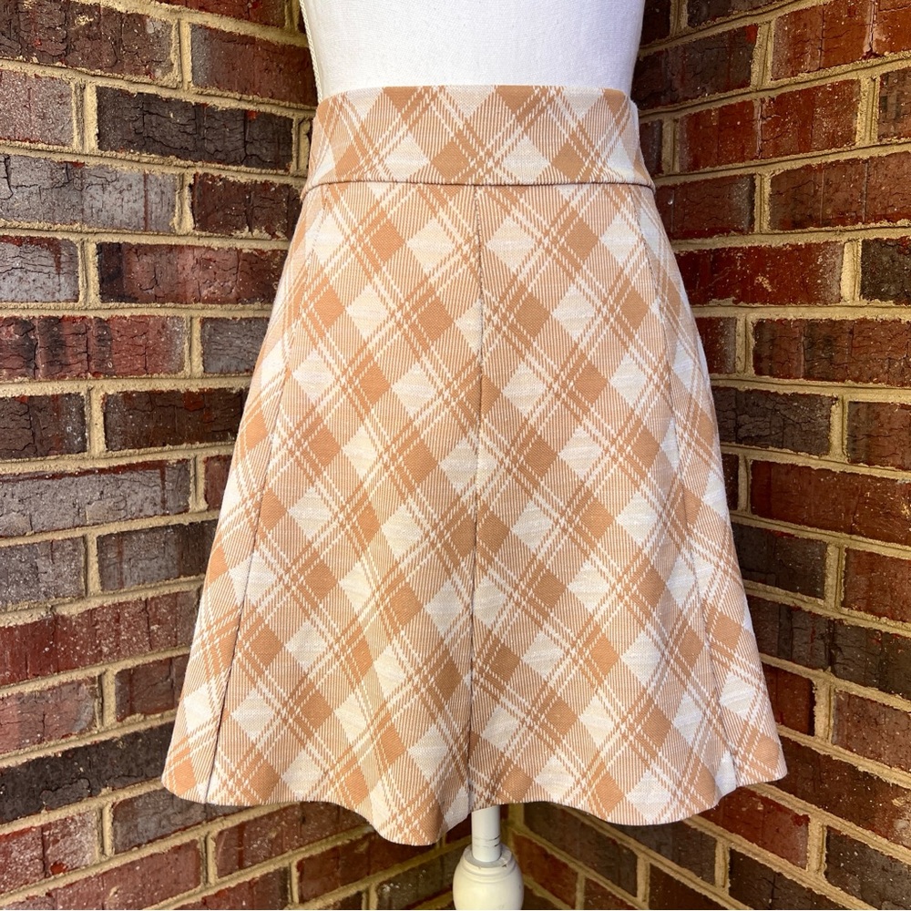 Vintage late 60’s/early 70’s tan and white plaid handmade
Mini skirt